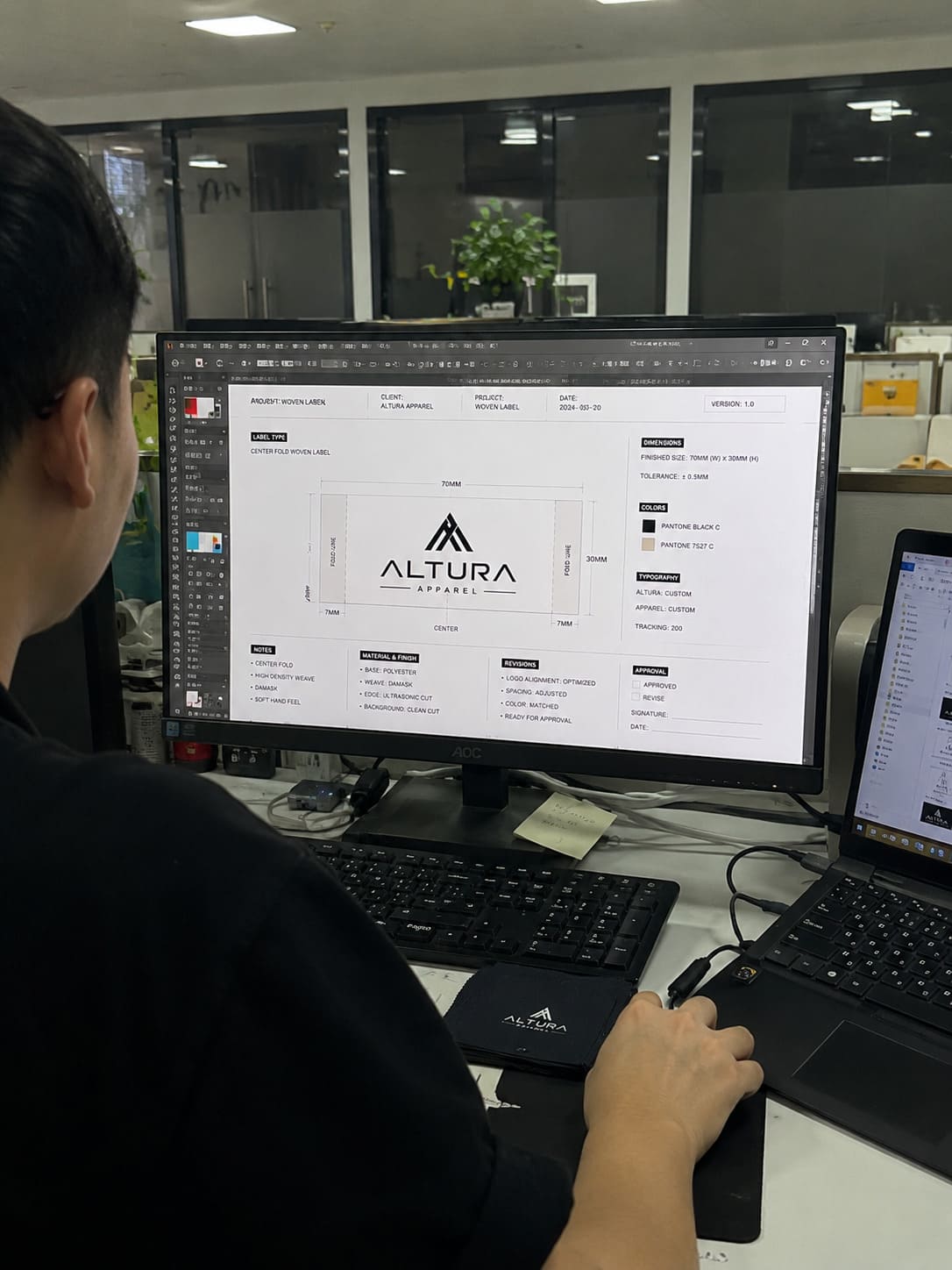 Expert designer reviewing and optimizing brand artwork for weaving